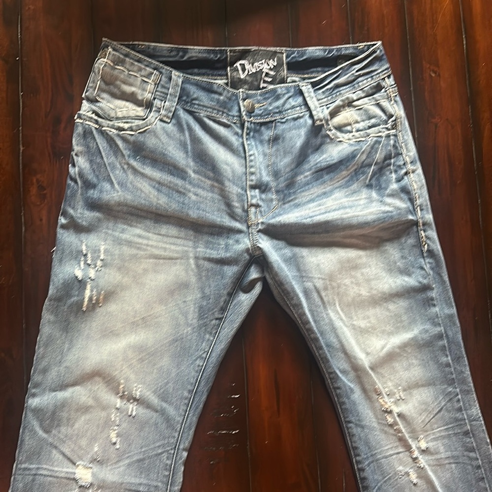 Distressed denim jeans